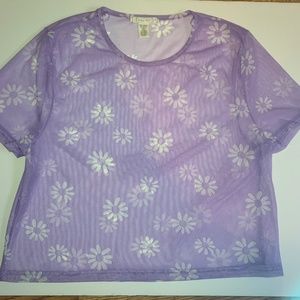A Lavender/Purple mesh shirt with white flowers from Tilly's